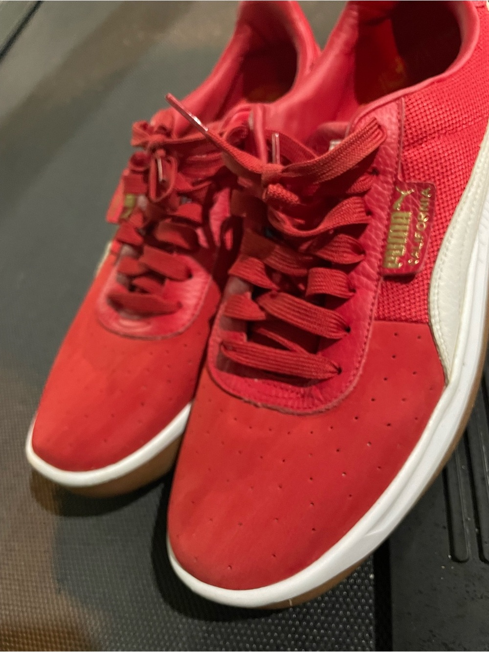 Red California Pumas, size 10.5. Great condition.